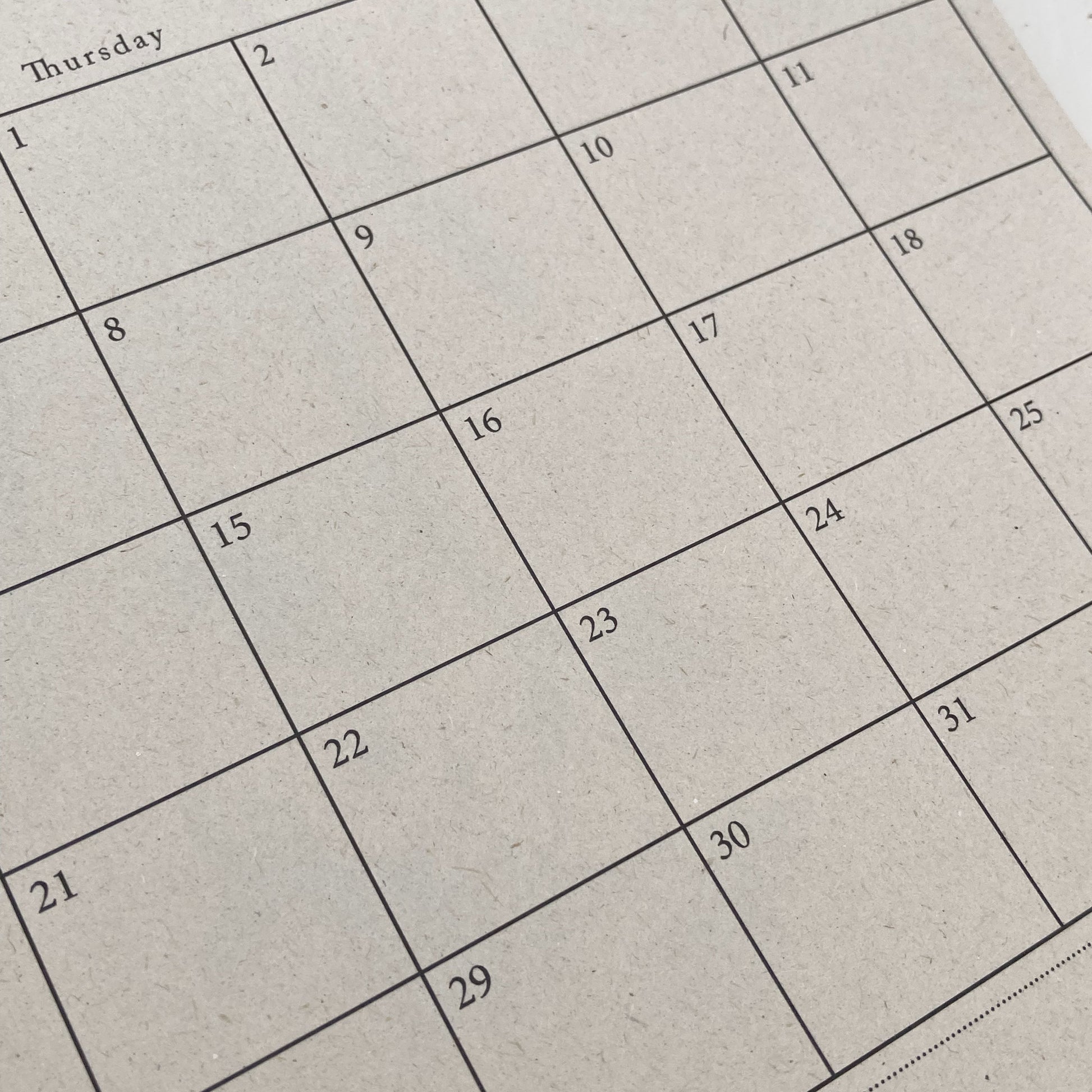 Calendar grid on a textured beige background