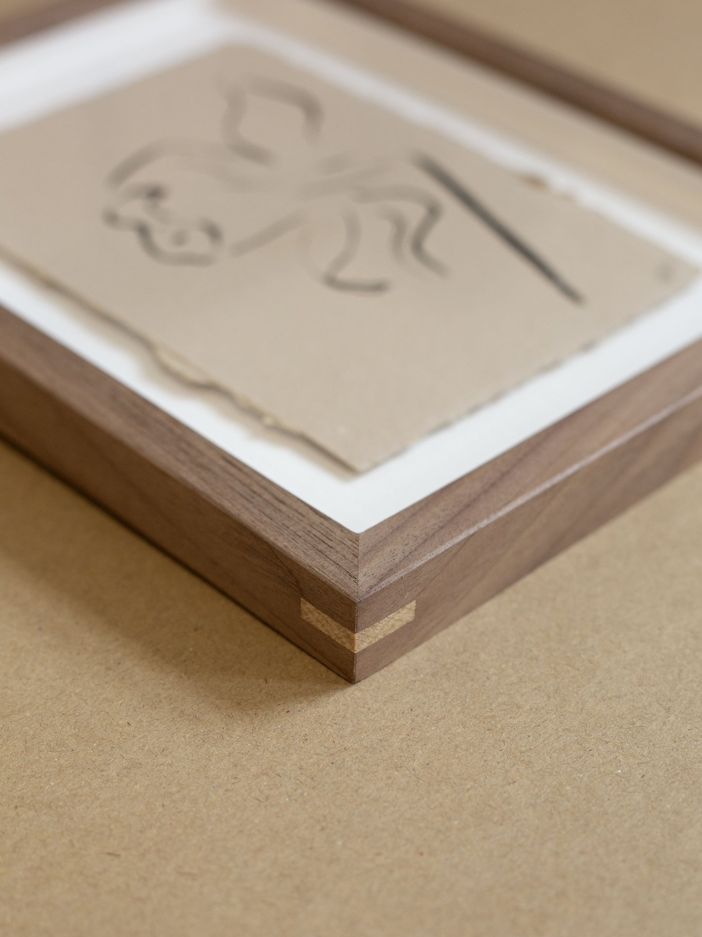 Close up of walnut wooden frame with oak splines
