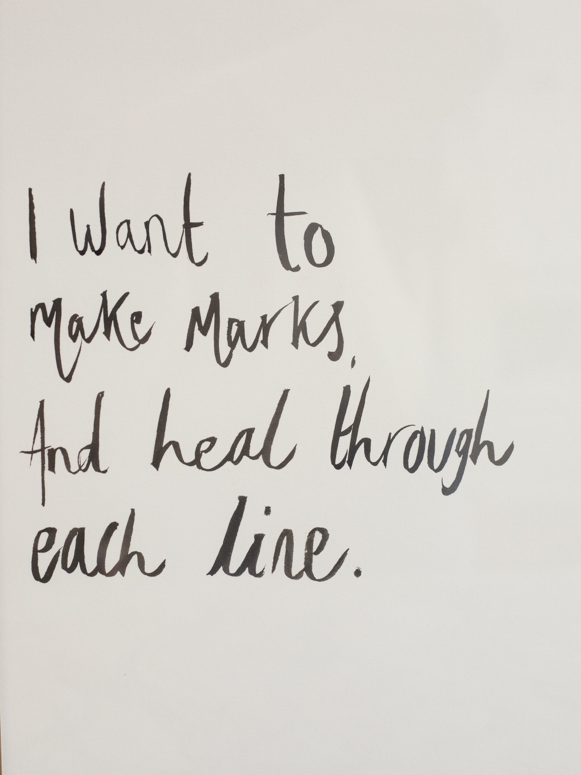 Handwritten text on a plain background