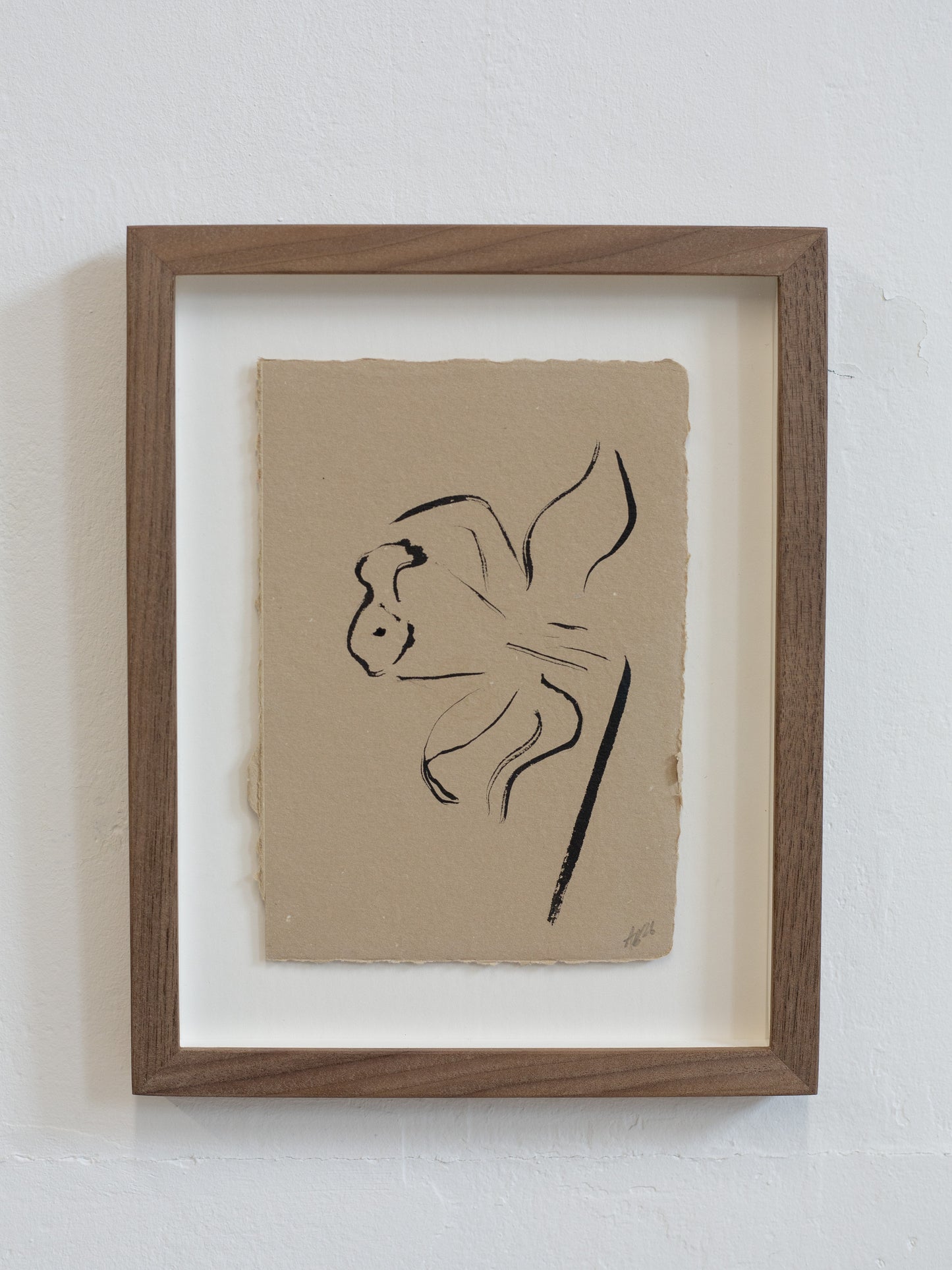 Framed artwork of a Daffodil on beige paper with a wooden frame.