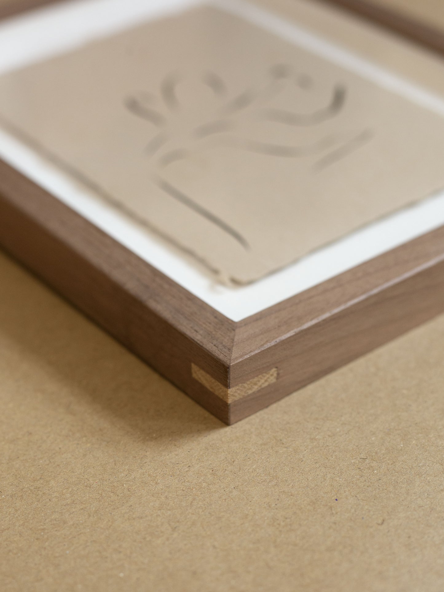 Wooden walnut frame with oak splines.