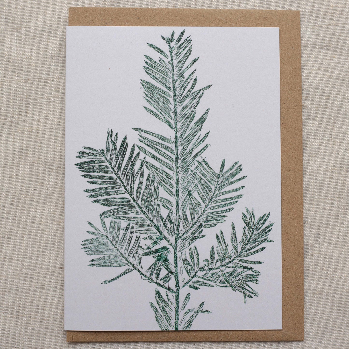Christmas card with yew tree leaf