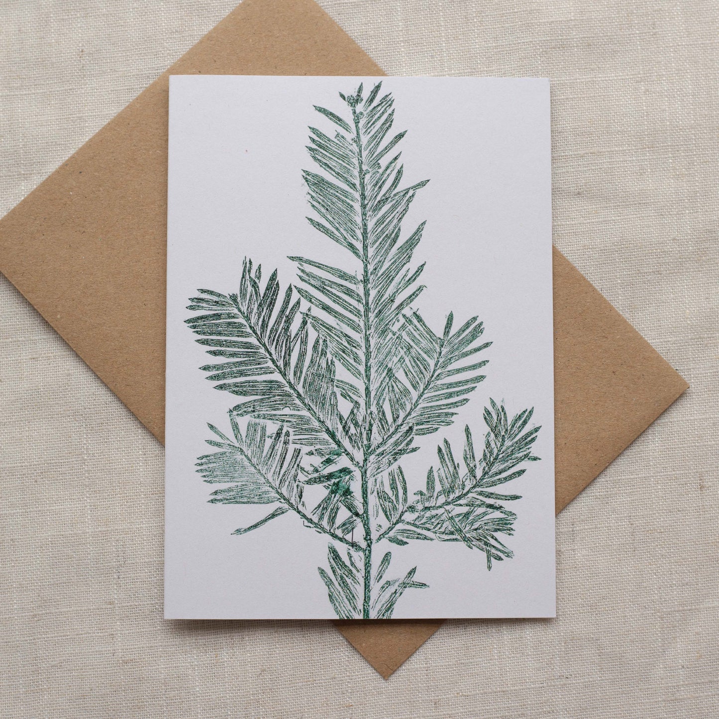 Yew christmas card, green ink on white paper