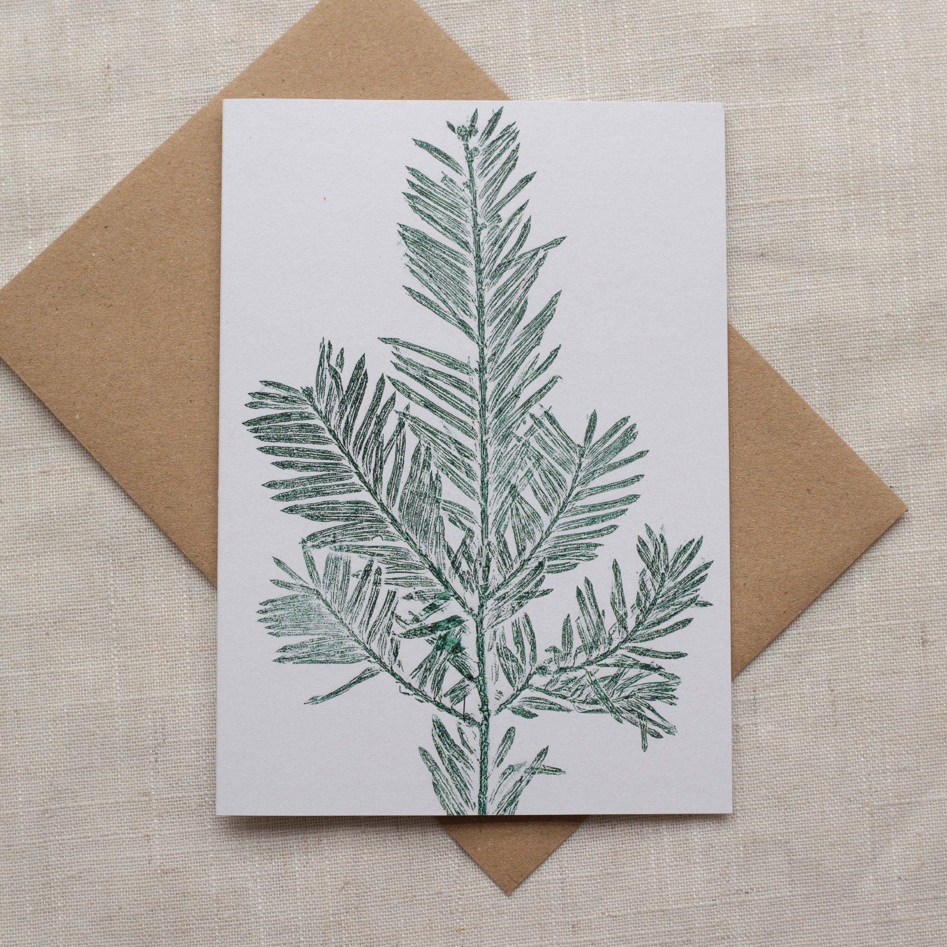 Yew christmas card, green ink on white paper