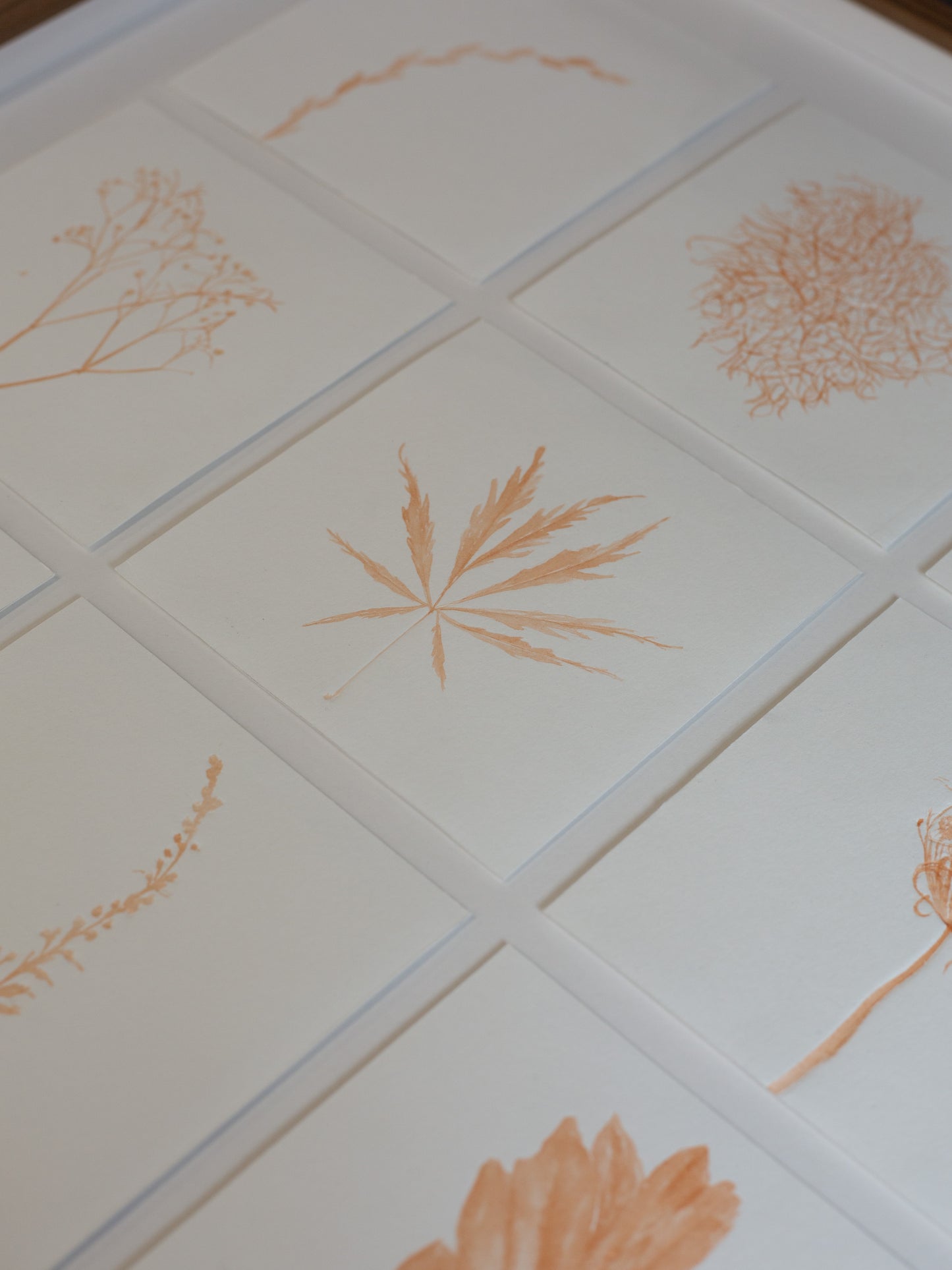 close up of the botanical embossings with madder ink
