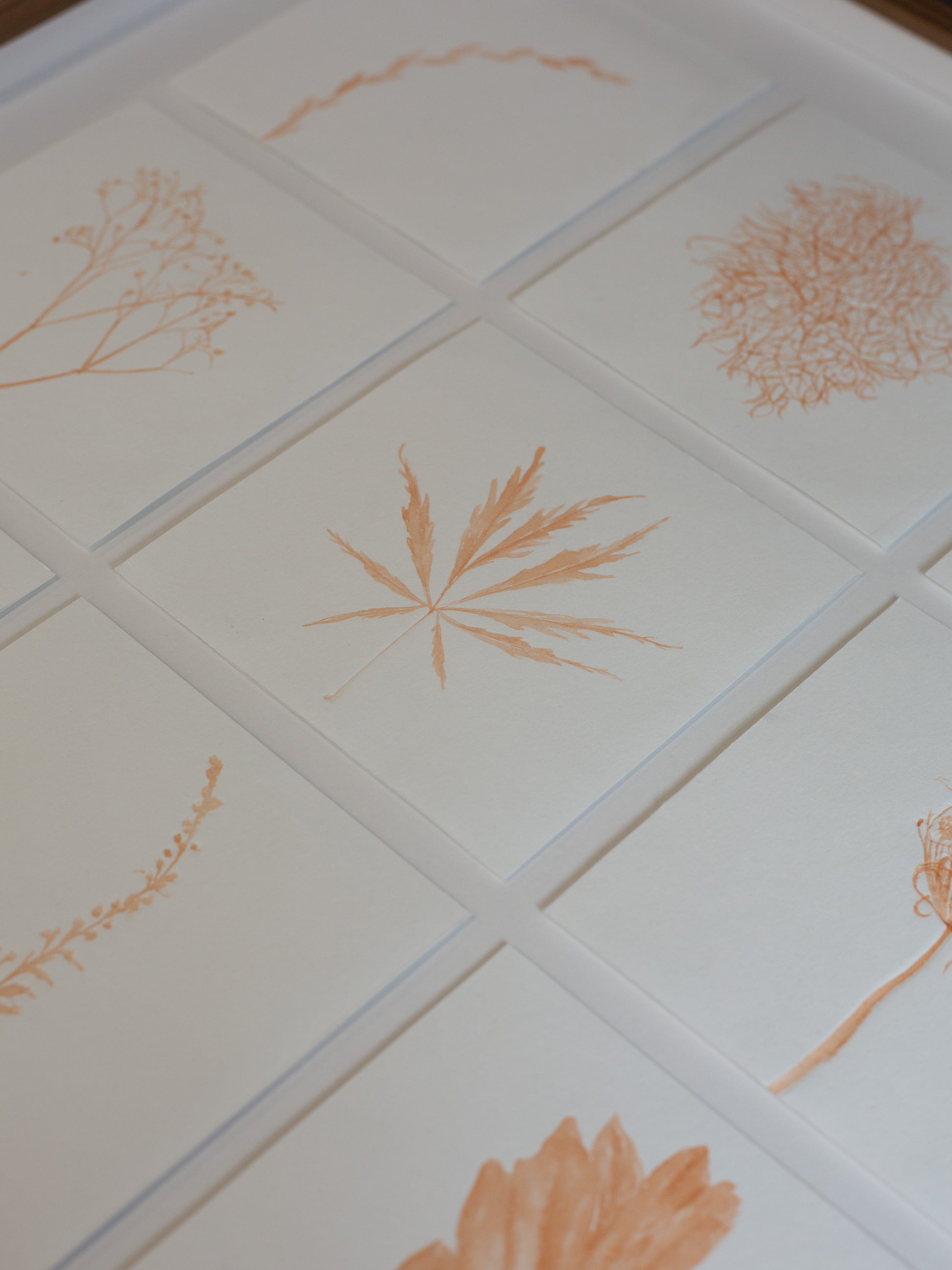 close up of the botanical embossings with madder ink